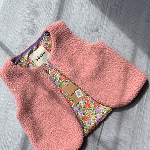 NWT Boden Girl’s Pink Sherpa Vest with Floral Lining, size 5-6 years.